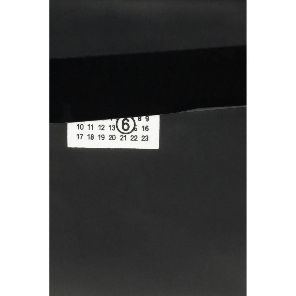 MM6 Schwarze Clutch-Tasche aus Kalbsleder Bos Taurus